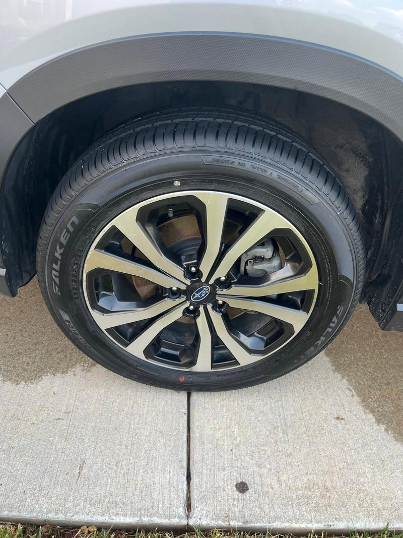 Truck wheel and tire after exterior detailing, clean and dressed