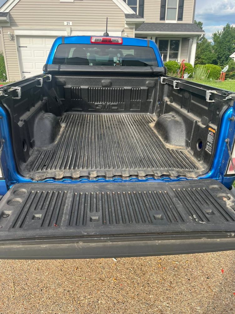 Truck bed liner before cleaning, dust and debris built up